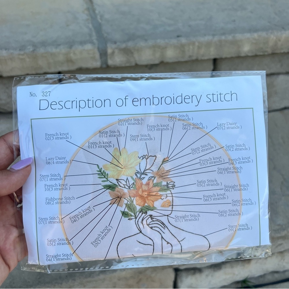 Female face with flower wrest embroidery kit